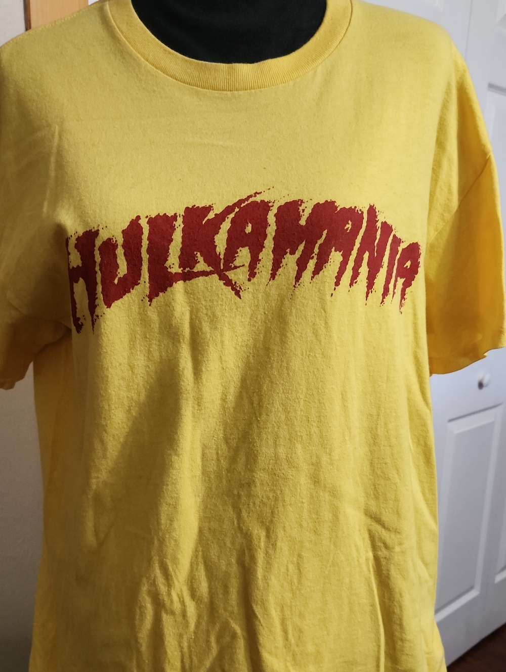 WWE Yellow Tee with Red HULKAMANIA Logo. Hulk Hogan